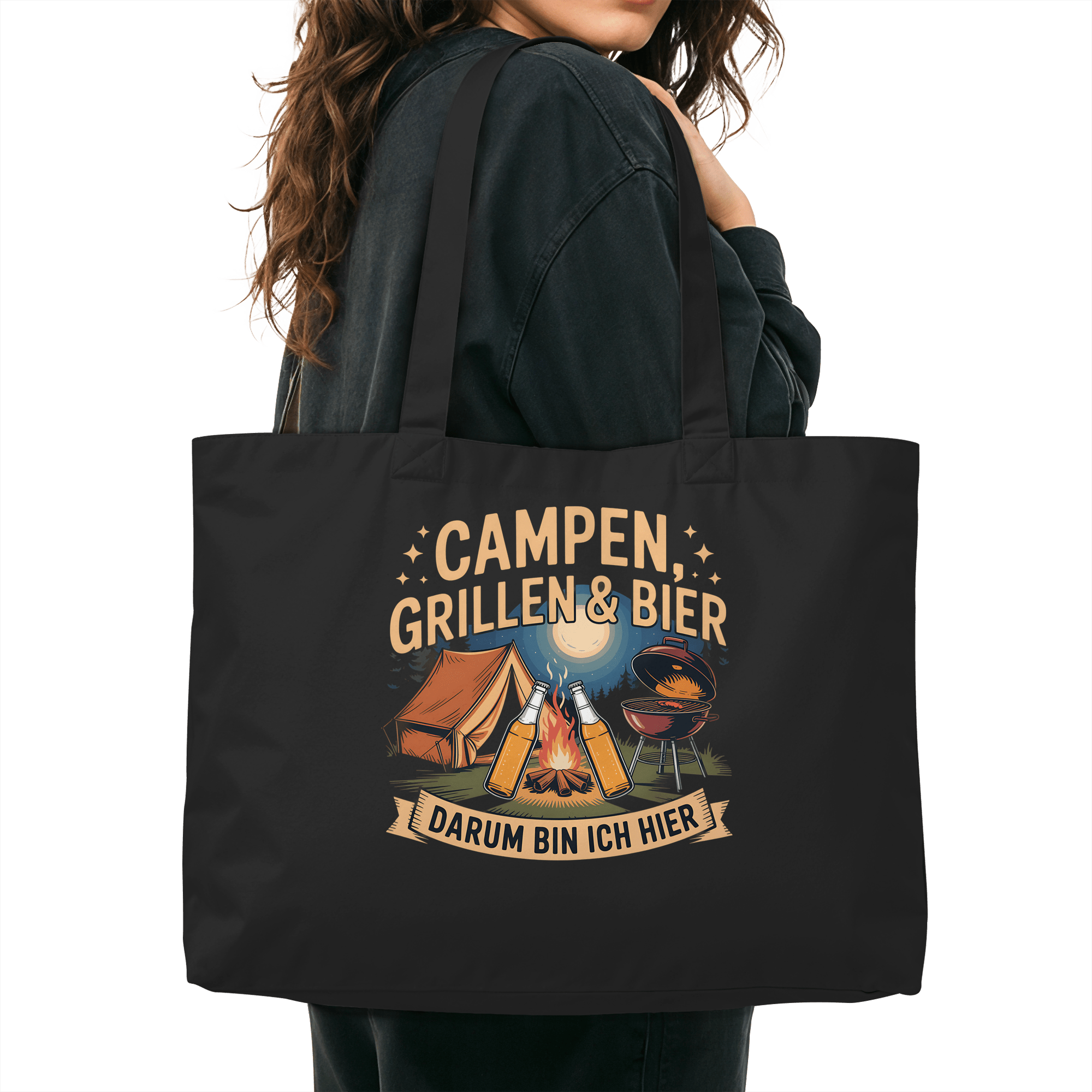 Woman carrying black organic shopping bag with 'Campen, Grillen & Bier' design, perfect for eco-friendly weekend trips.