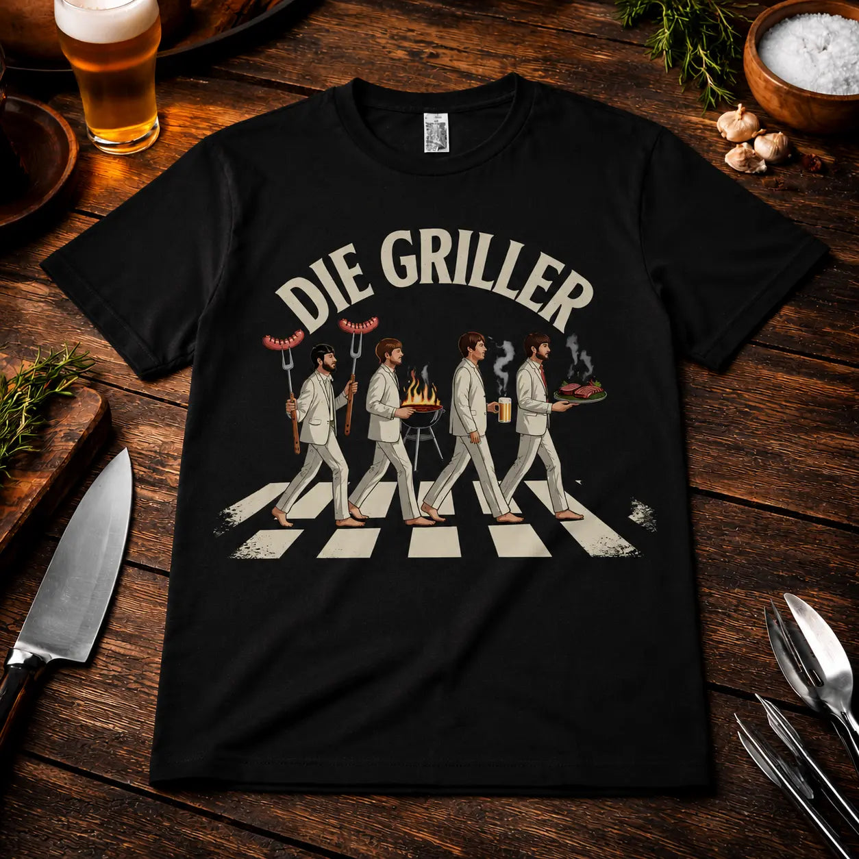 Meatware Die Griller T-Shirt mit humorvollem BBQ-Zebrastreifen-Motiv, Grillmeister mit Würstchen, Bier und Grillgut auf schwarzem Shirt im rustikalen Grill-Mockup mit Bier und Grillbesteck.